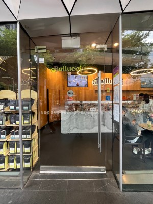 Glass door. Pull metal handle on right.