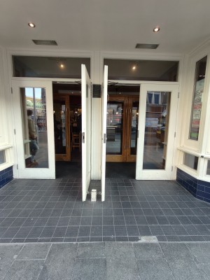 Two sets of preceding doors on left and right.