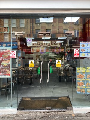 Glass doors ahead. Push to open via metal handles in center.
