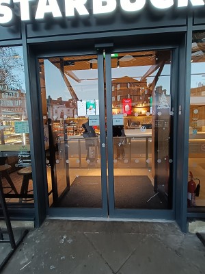 Glass doors with black frame.