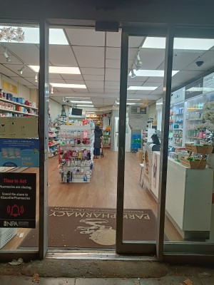 Glass door with black frame. Slide black, metal handle from left to open.