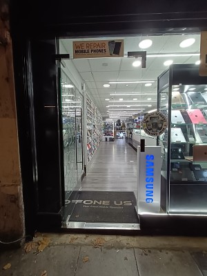 Glass door with silver, metal handle on right. Push to open.