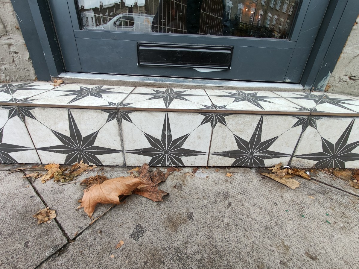 One large step up before door.
