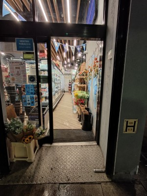 Facing black framed glass doors.