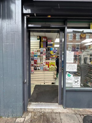 Glass door with grey frame. Slide open to left. Small