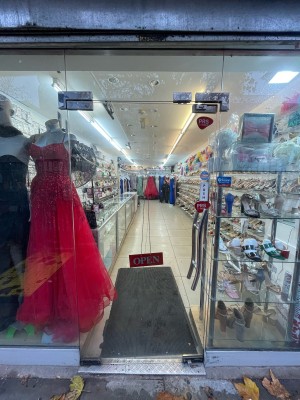 Glass door in glass frame. Push metal handle on right to open.