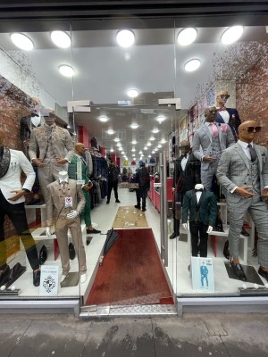 Glass door in glass frame. Push metal handle on right to open.