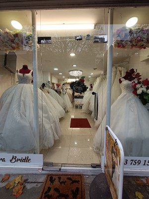 Glass door with silver, metal handle on right. Push to open.