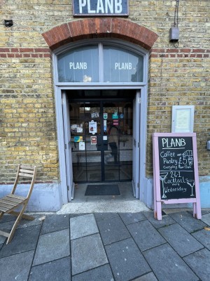 Grey wooden doors ahead. Push from middle to open.