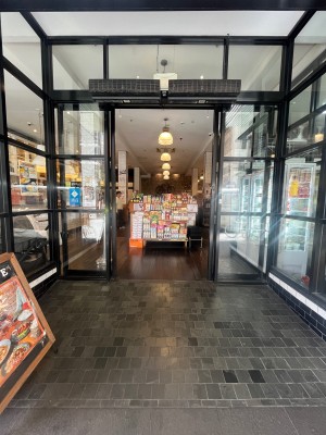 Doors with black metal frame slide open from middle. Doors typically kept open.