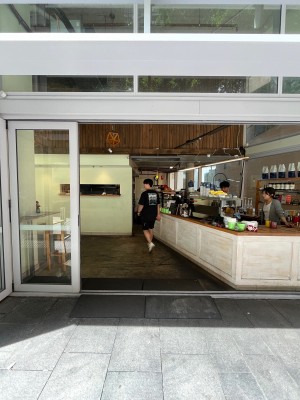 Glass door with silver frame slides open to right. Door typically kept open.
