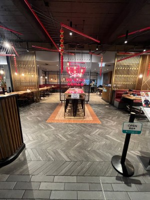 Archway to outdoor front area. Archways to venue ahead to either side of central table.