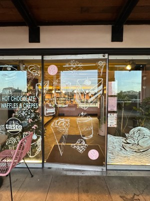 Glass door. Pull metal handle on right to open.