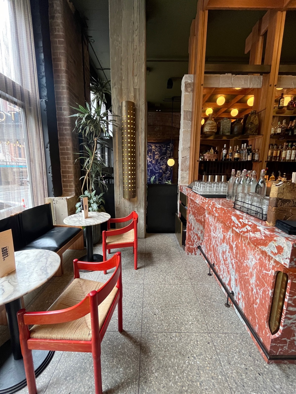 From corner of bar facing right. Half booths along left wall.