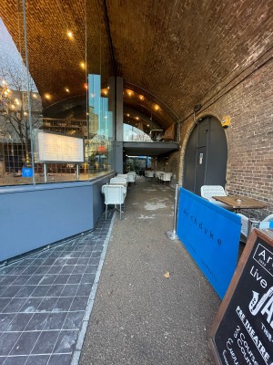 From right of main entrance facing straight. Path ahead to step-free entrance.