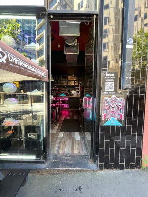 Glass door with gold pattern. Push from left.