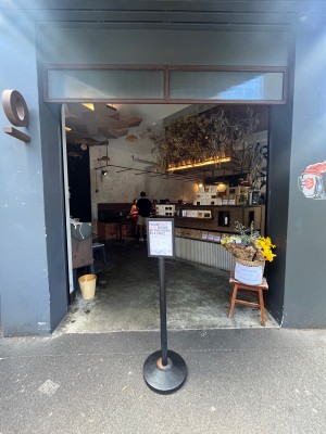 Open archway to venue. Signage obstructing in middle.
