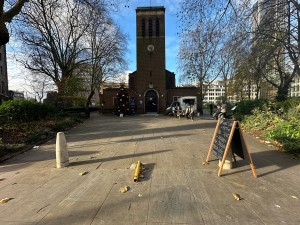 Opening ahead. Pillars dotted along opening. A-frame board ahead to right.