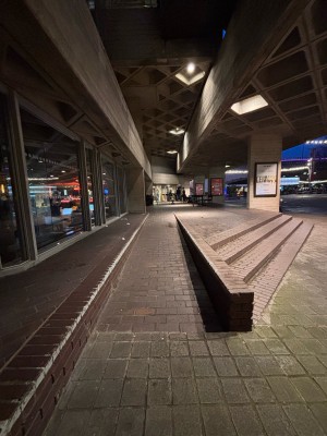 From National Theater main entrance facing right. Built in ramp ahead. Stairs at right.