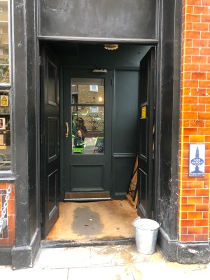 First set of black doors. Push from middle to open.
