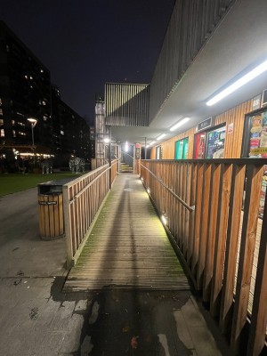 Built in ramp to staircase and lift. Handrails either side. Deck flooring on ramp.