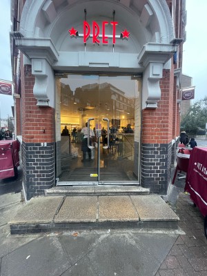 Glass doors with silver metal handles in centre ahead. Push from centre to open.