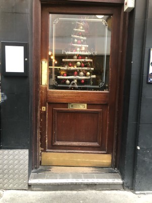 Brown wooden and glass door ahead.