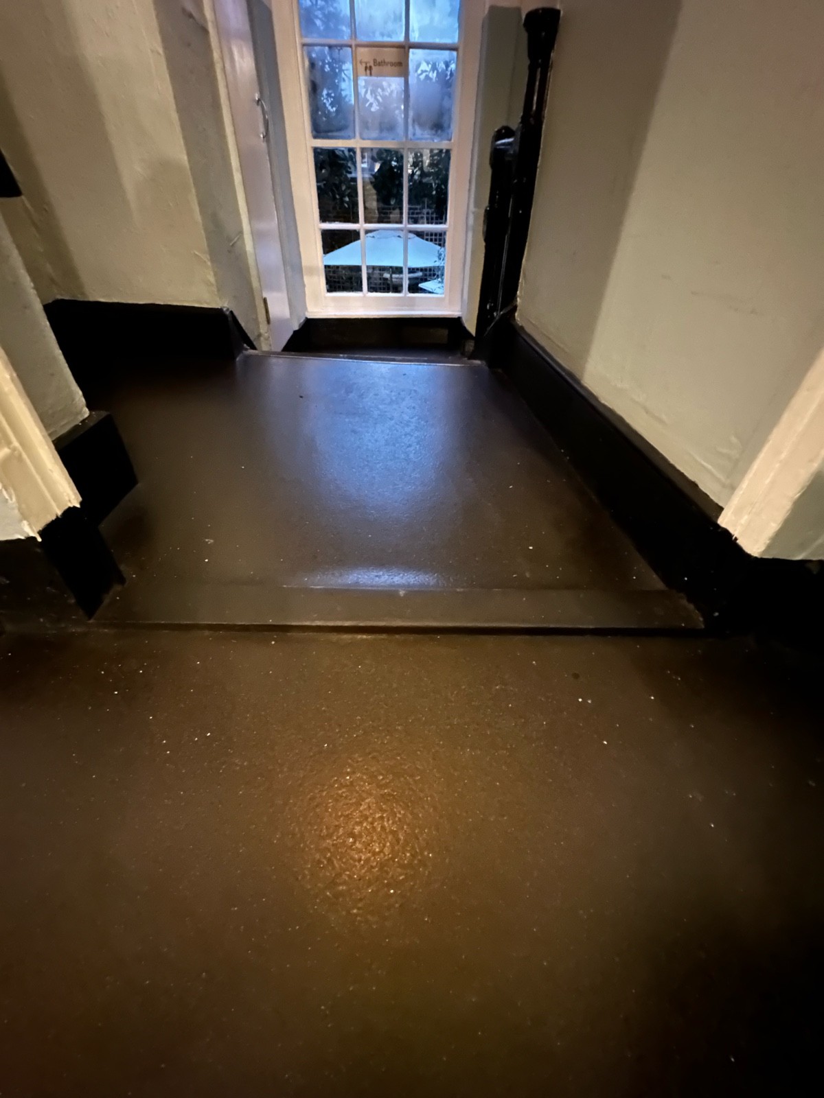 Raised edge at foot of archway.