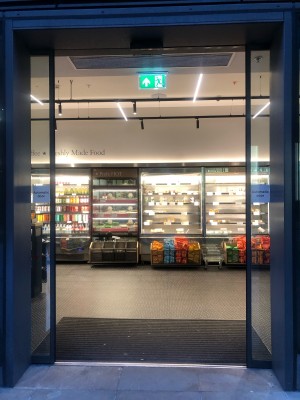 Glass automatic doors. Enter from middle to open.
