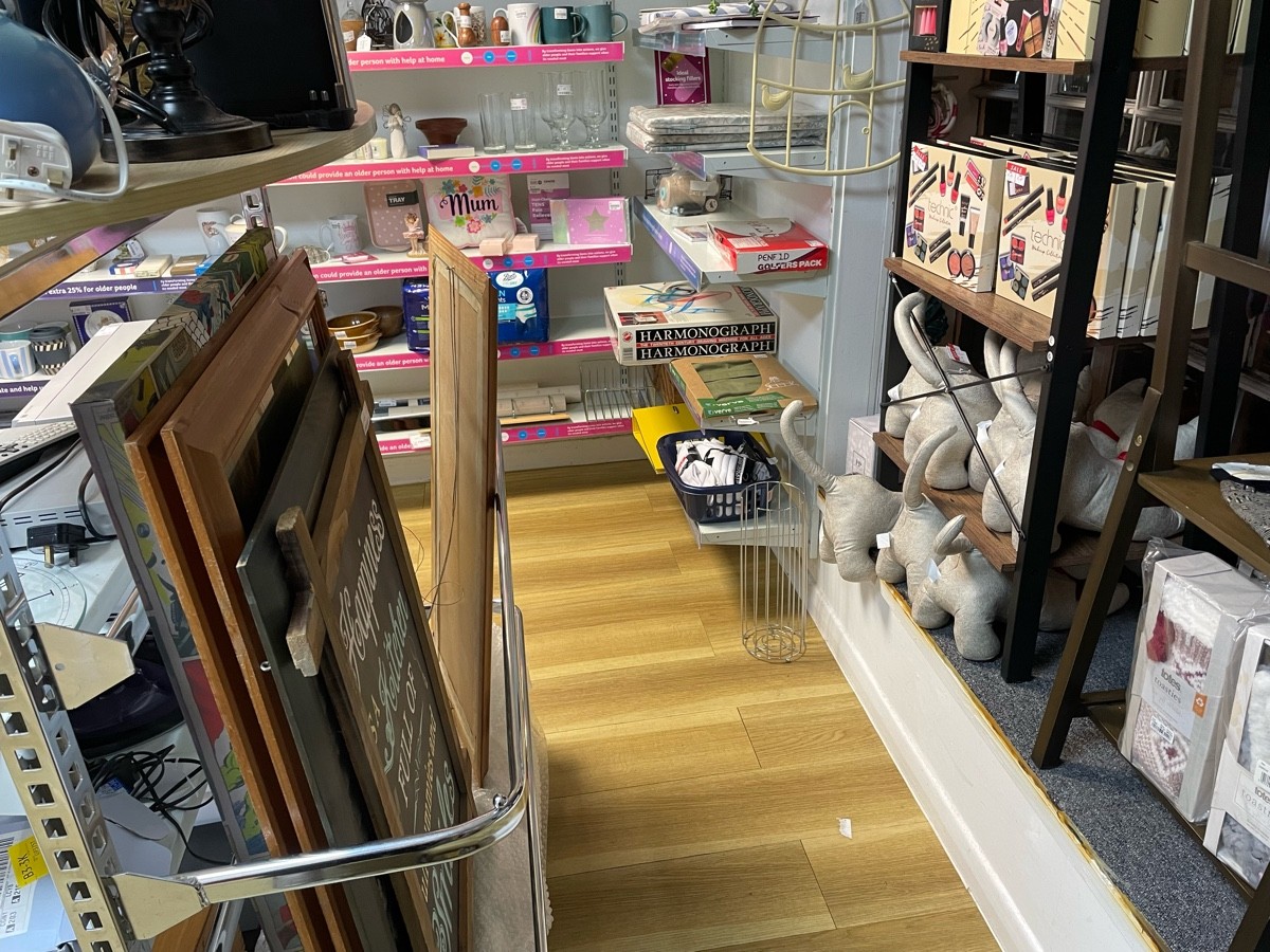 This pathway is from the textiles rail to the bric-a-brac. On your right is the window and to the left is a rack of bric-a-brac