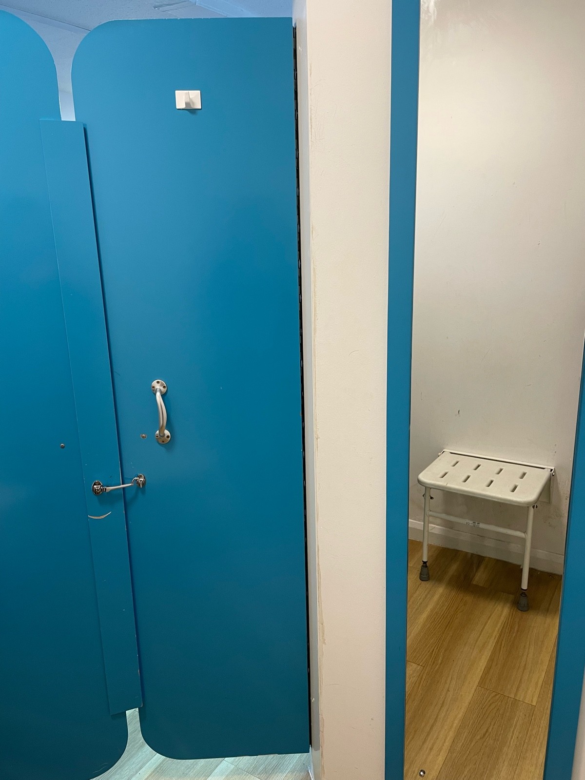 This is the view from inside the room, the double doors have a latch lock 90cm high, there is a seat and a full length mirror that is 30cm wide