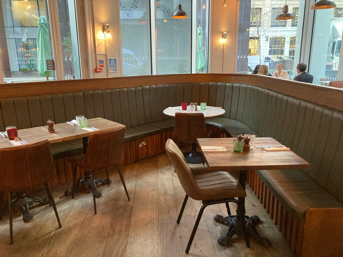 From divider, facing right. Half booth along right and back.