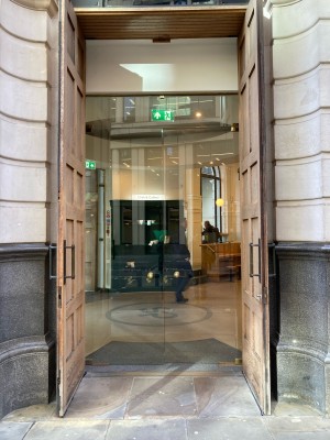 Wooden doors ahead. Pull doors to open from handles in center.