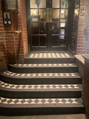5 steps up ahead with handrail along left.