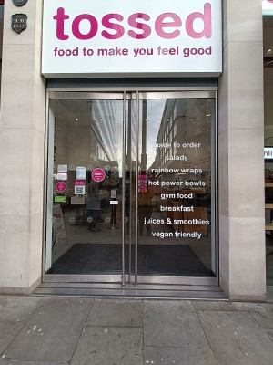 Metal-framed glass doors. Push from silver handles in middle to open.