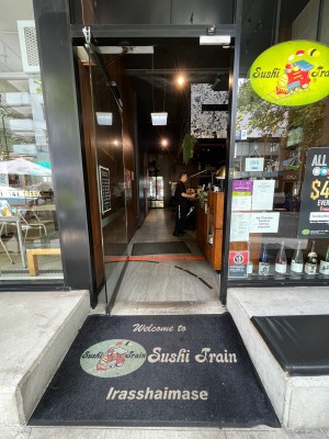 Glass door. Push from right.