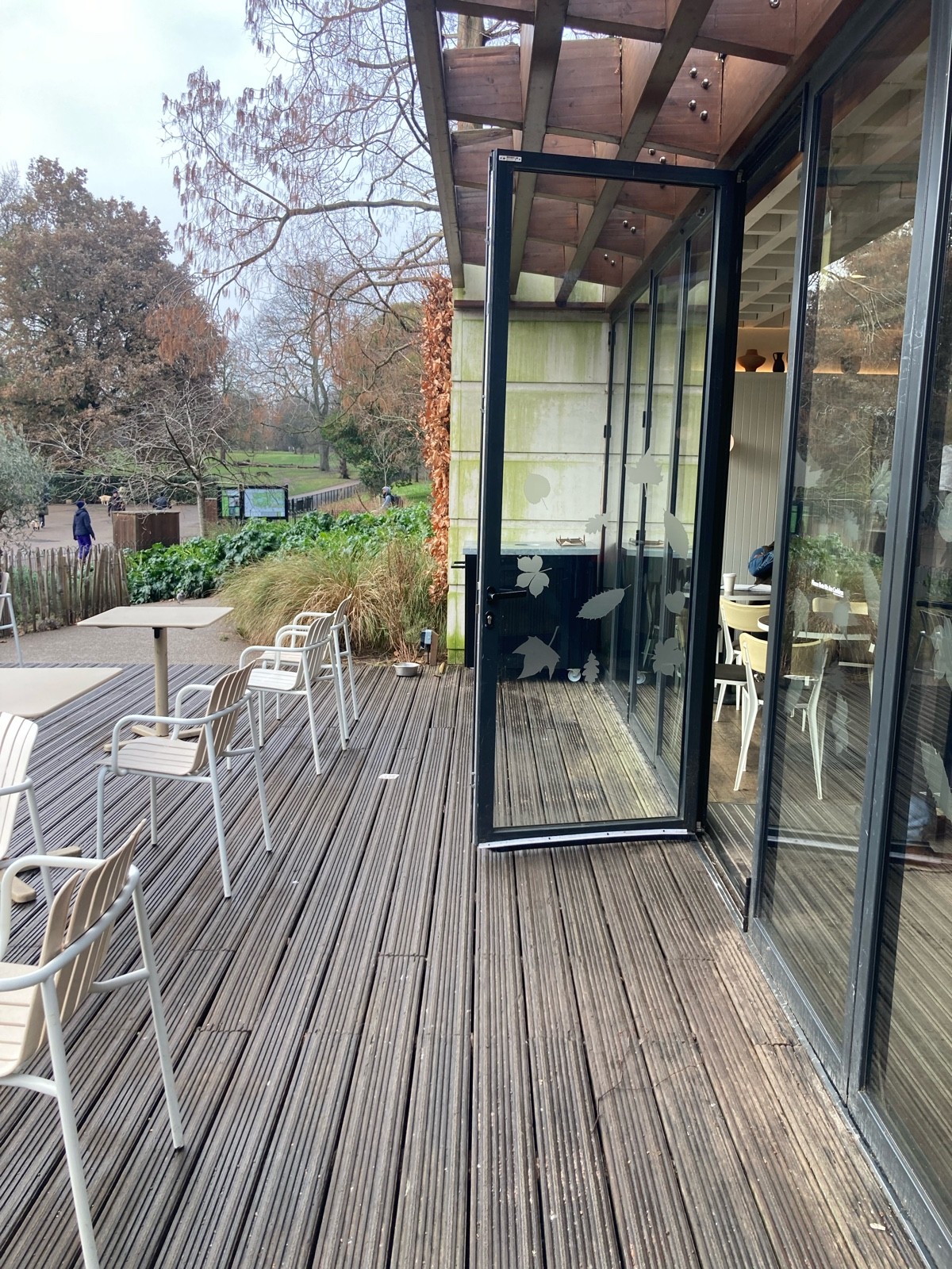 From end of path, facing left. Path ahead to entrance on right. Seating along left.