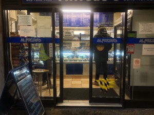 Glass doors with brown frame. Slide from centre to open.
