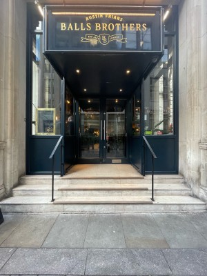 From street facing venue. Three steps up ahead before doors. Metal handrails along both sides.