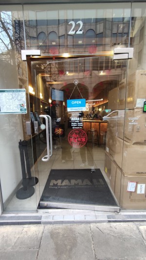 Glass door ahead. Push metal handle on left to open.