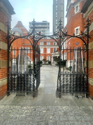 From street facing venue. Black metal gate ahead for main hotel entrance. Push from centre right to open.