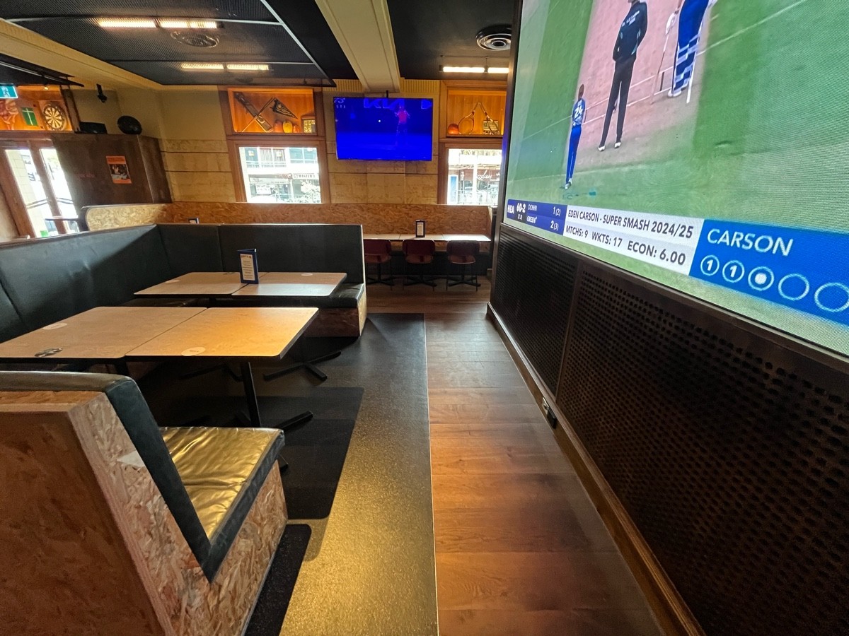 From after high bar facing left. Booths on left wall.