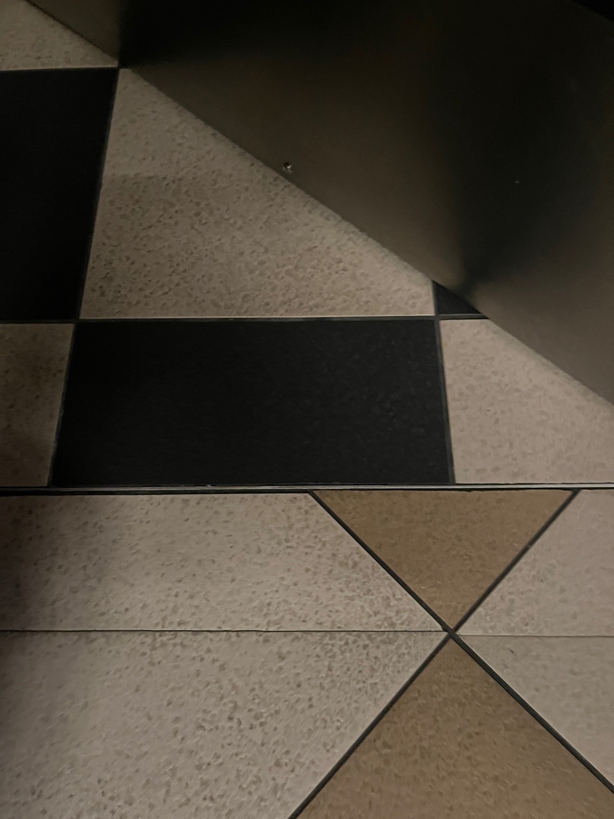 Small bump at foot of preceding door.