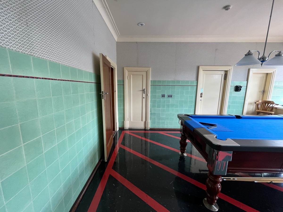 From door facing straight. Pool table to right.