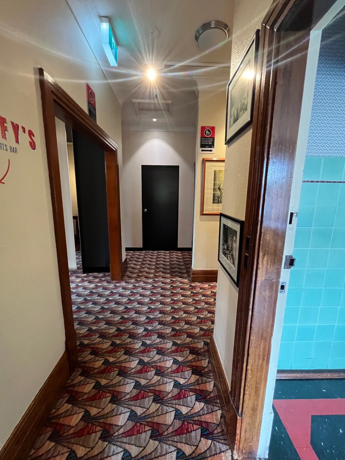 From glass door facing straight. First room on right wall. Path through area continues facing right further ahead.