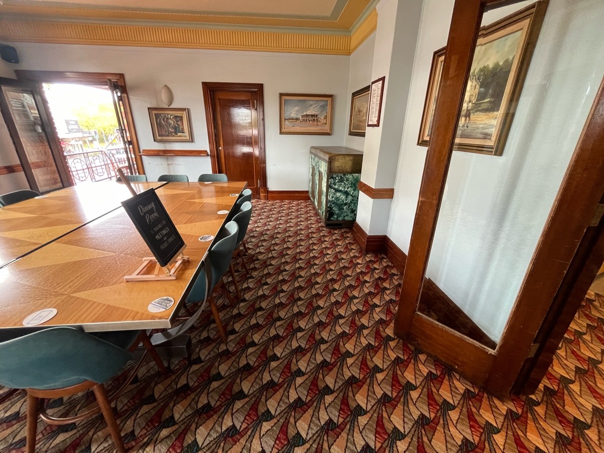 From doors facing right. Large table to left. Doors to first terrace on wall ahead to left.