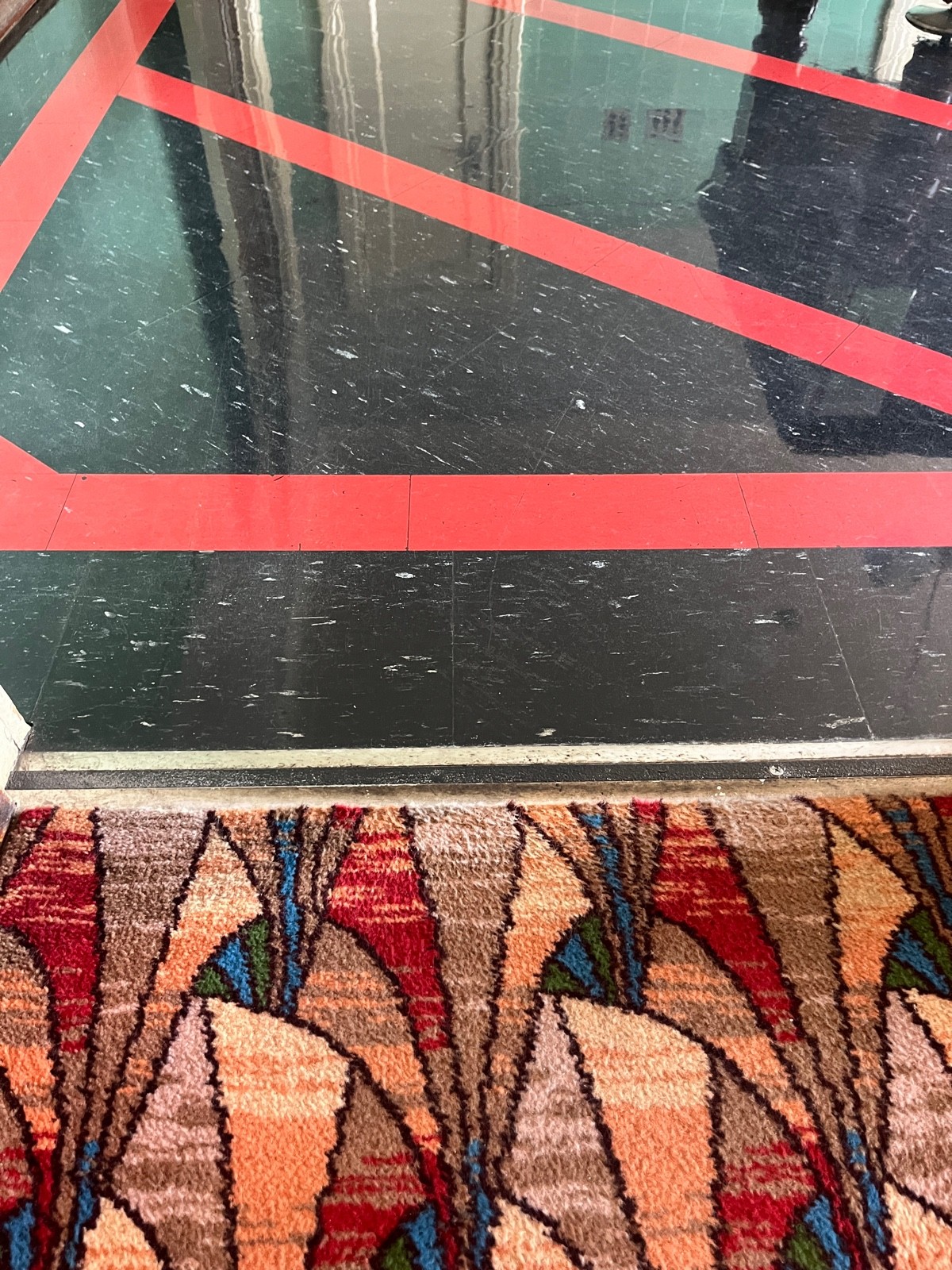 Small bump at foot of door to first room.