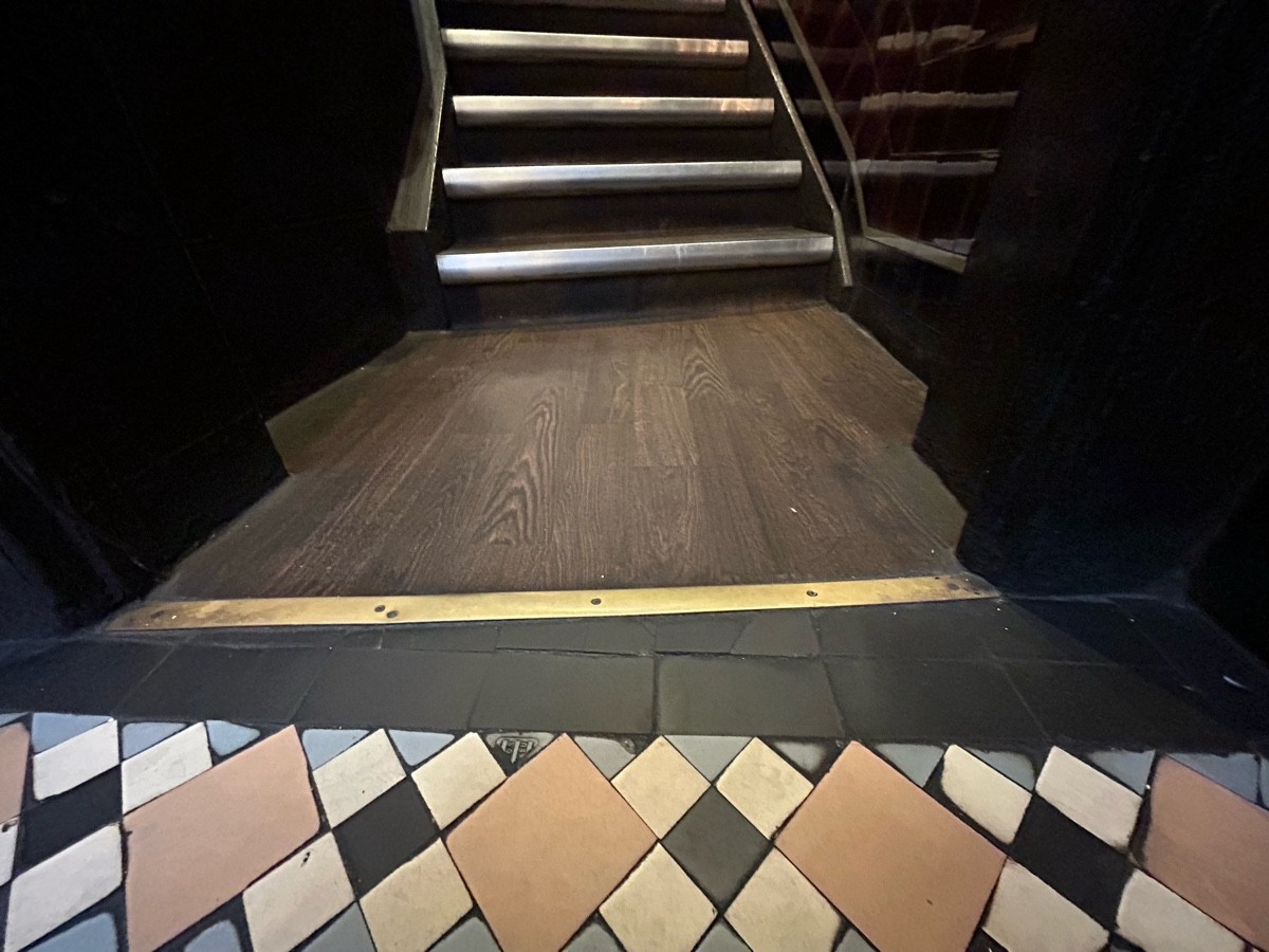 Small bump at foot of archway.