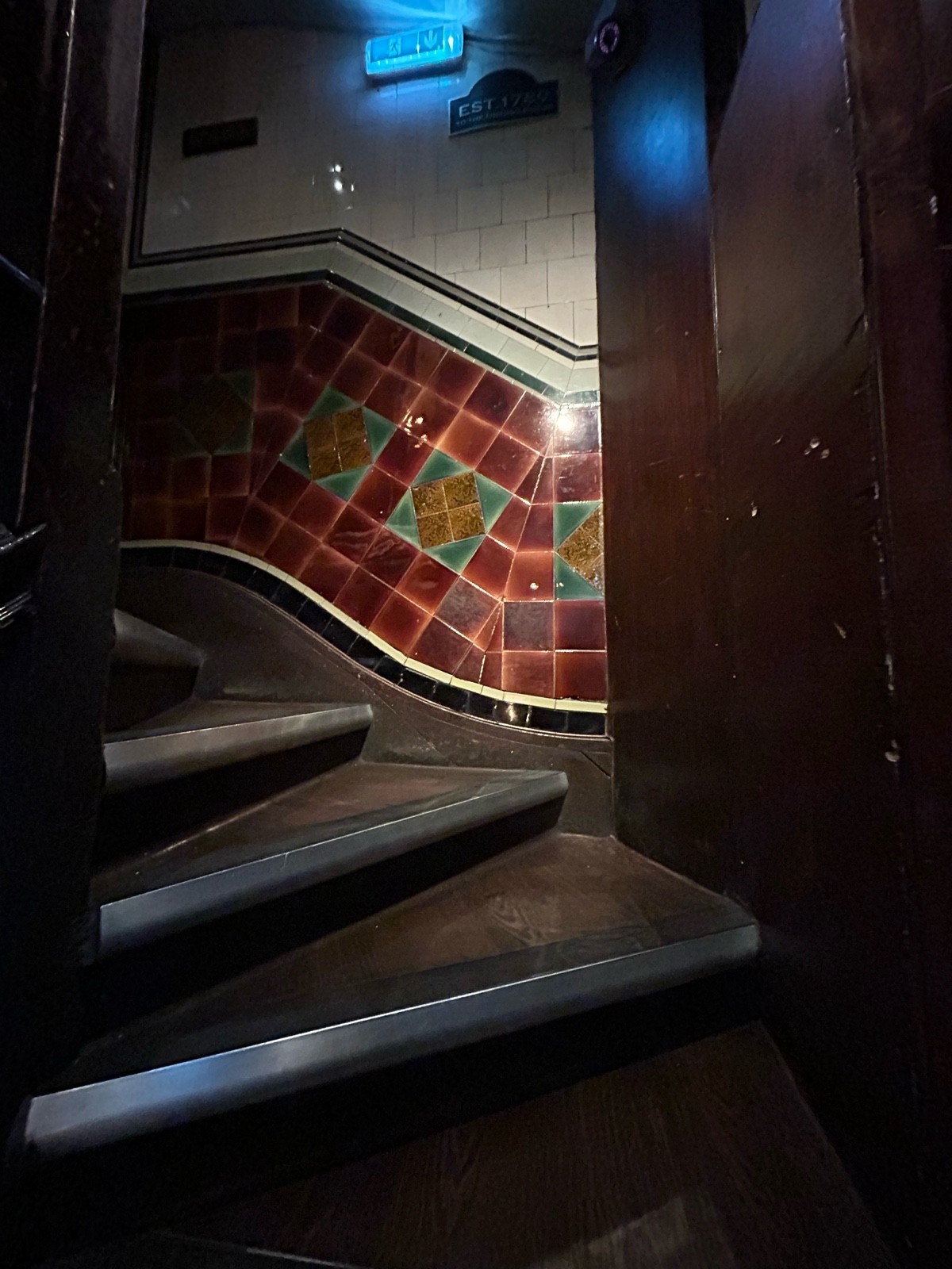 From before curve facing straight. Stairs curve left. Handrail on left.
