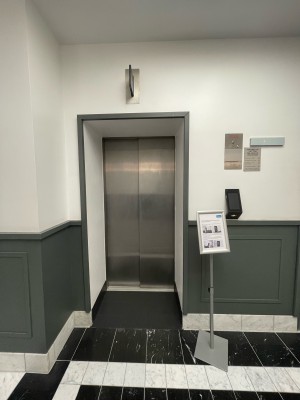 From after security desk facing right. Call buttons and instructions on right.